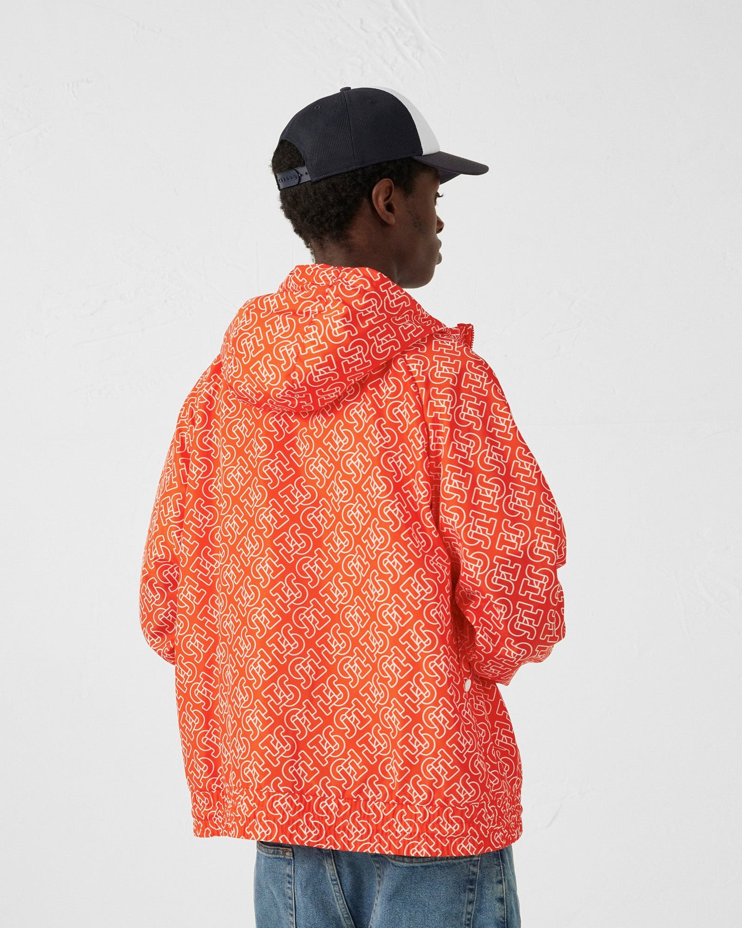 Blouson coupe-vent léger à capuche Mono rouge feu Storm monogram